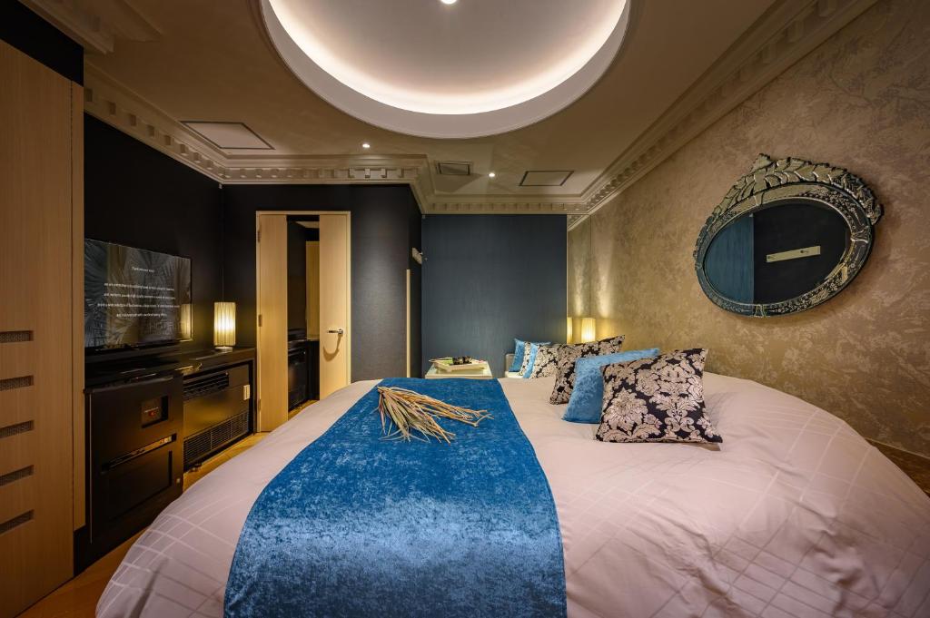 Postel nebo postele na pokoji v ubytování HOTEL C.KOHOKU