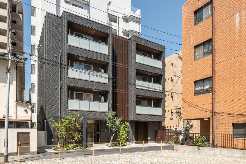 een afbeelding van een appartementencomplex in een stad bij GRAND BASE Yakuin Odori in Fukuoka