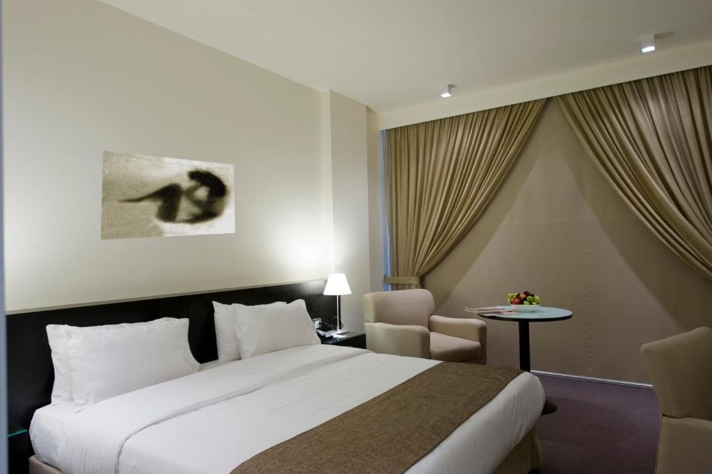 Postel nebo postele na pokoji v ubytování Hotel Cavalier