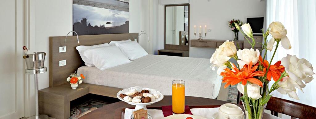 Een bed of bedden in een kamer bij Dimora Del Dragone