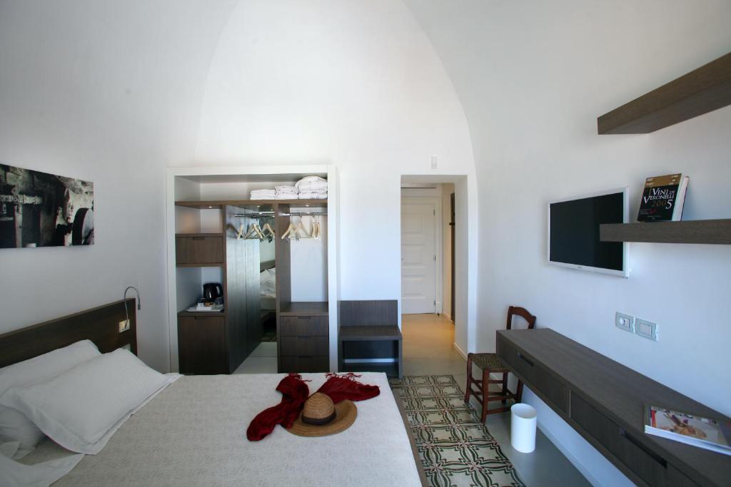 Een bed of bedden in een kamer bij Dimora Del Dragone
