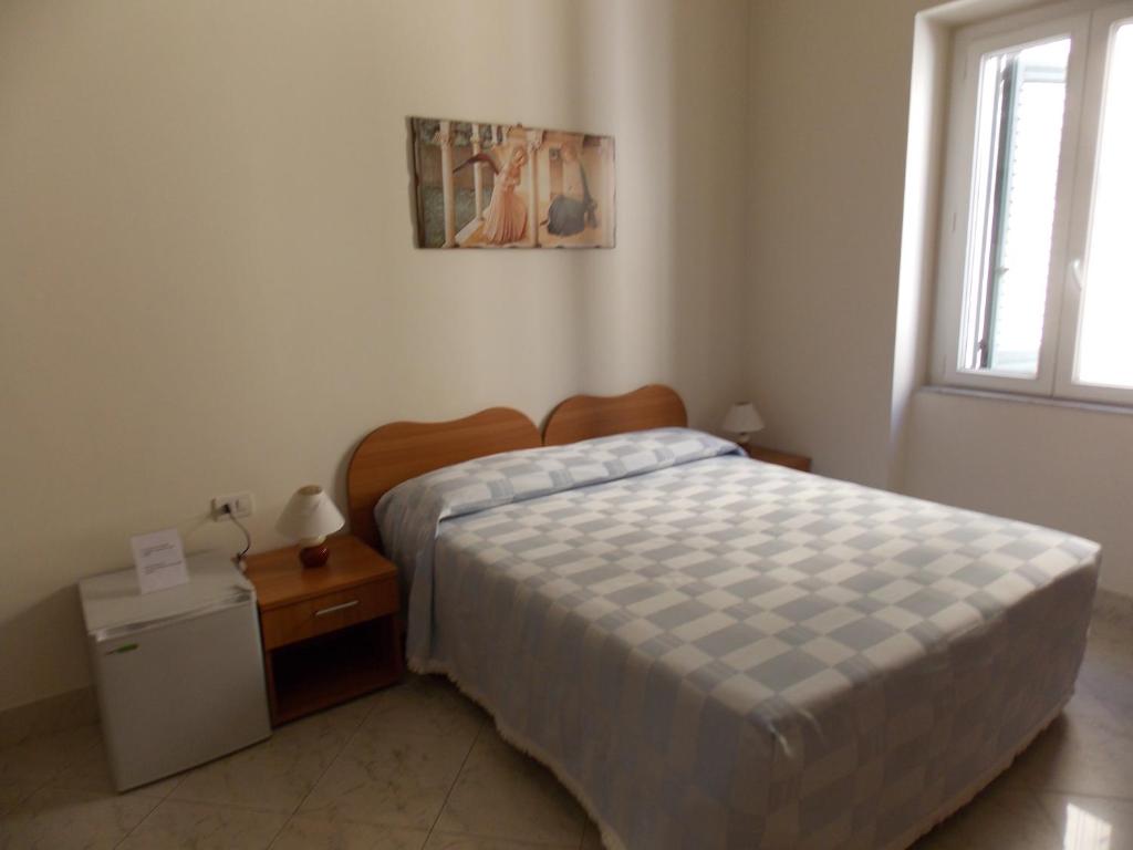 Postel nebo postele na pokoji v ubytování Albergo Roma