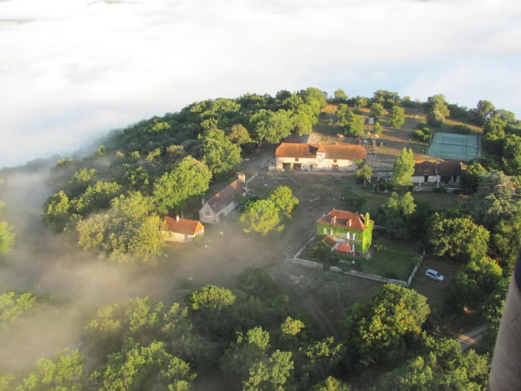 an aerial view of a house on a hill at Domaine de Gayfié in Salvagnac-Cajarc
