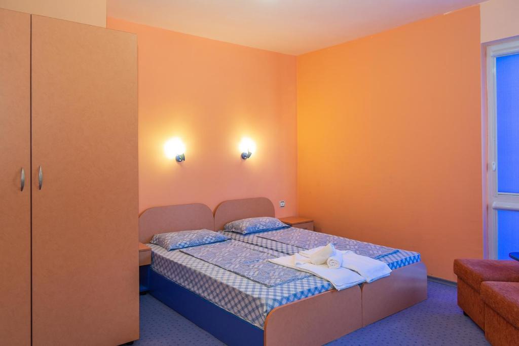 Postel nebo postele na pokoji v ubytování Dara Hotel