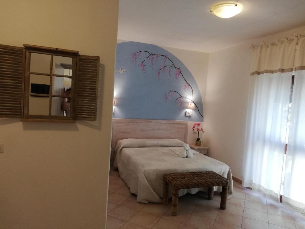 Postel nebo postele na pokoji v ubytování Hotel Tabby