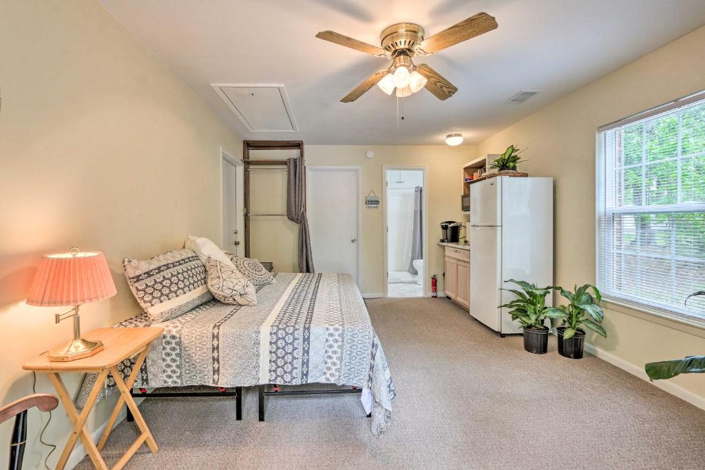 a bedroom with a bed and a ceiling fan at Cozy Studio with Yard, 6 Miles to Dwtn Beaufort! in Beaufort