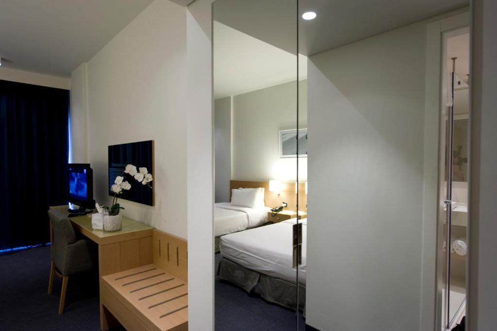 Postel nebo postele na pokoji v ubytování Hotel Cavalier