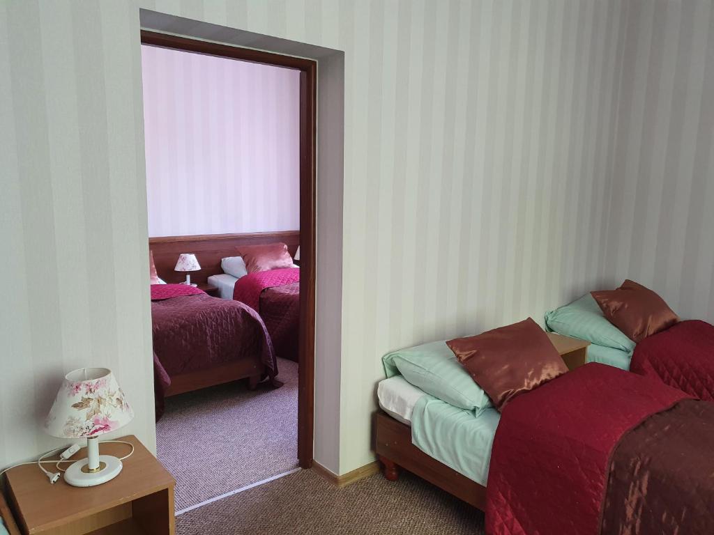 Posteľ alebo postele v izbe v ubytovaní Hotel Sudety