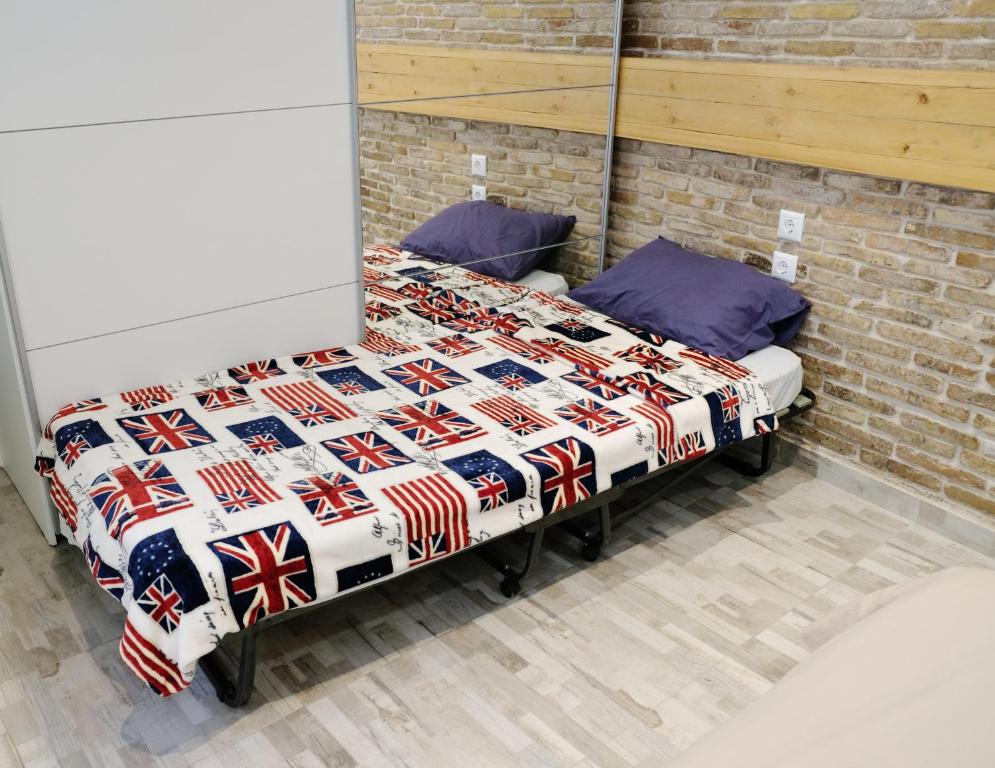A bed or beds in a room at George Studio