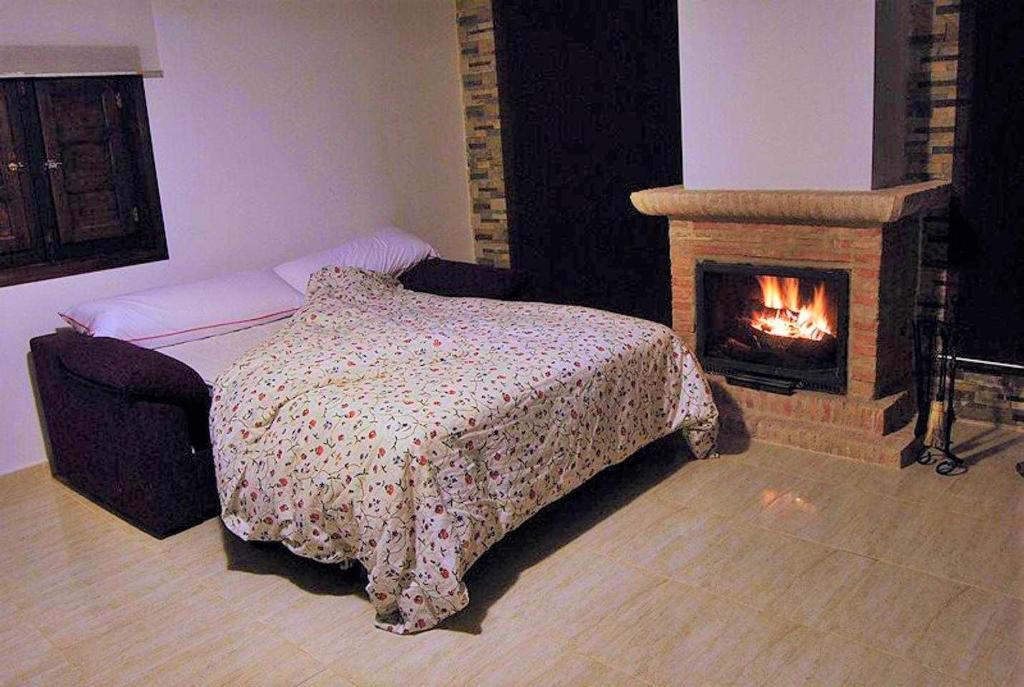 A bed or beds in a room at Casas Rurales Villa Sem Sem