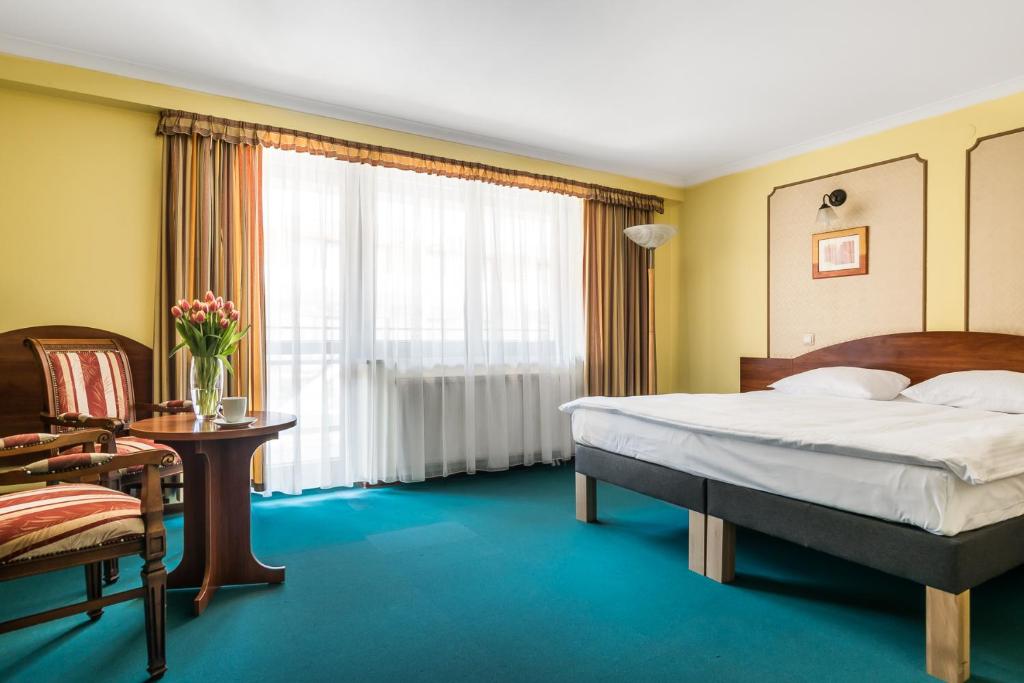 Postel nebo postele na pokoji v ubytování Hotel Wersal