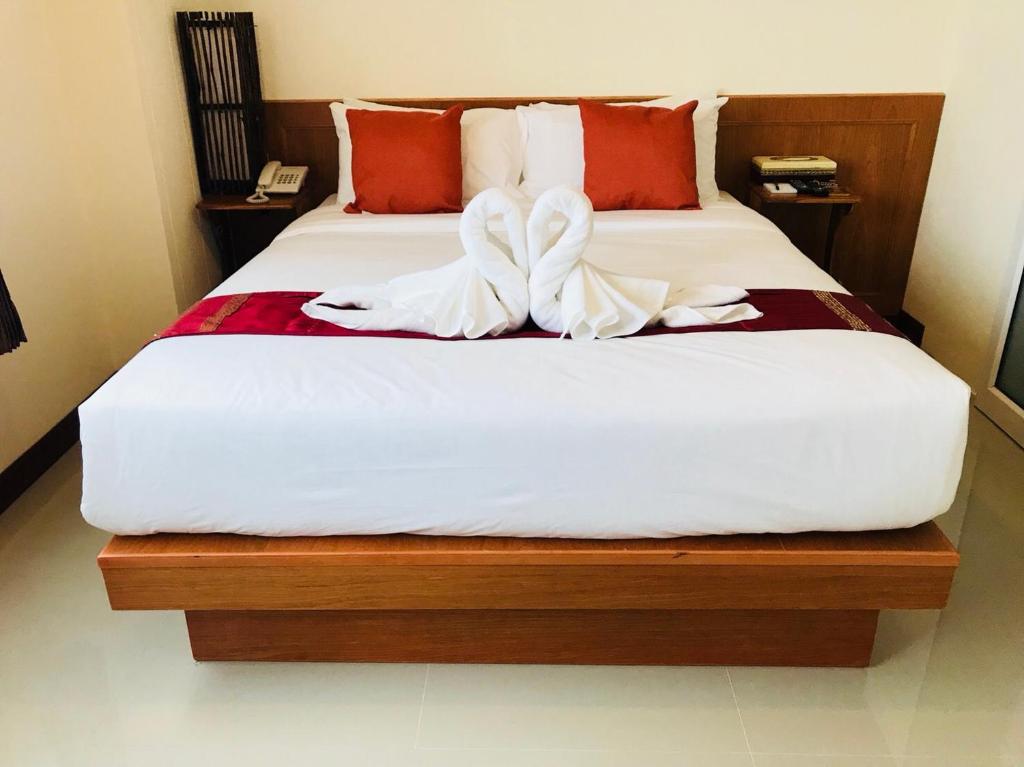 Postel nebo postele na pokoji v ubytování Phurua Inn ภูเรือ อินน์