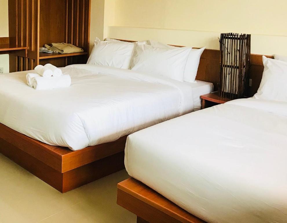 Postel nebo postele na pokoji v ubytování Phurua Inn ภูเรือ อินน์