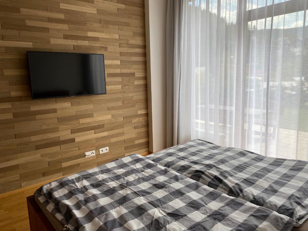 Postel nebo postele na pokoji v ubytování Apartmán Medvědín 110