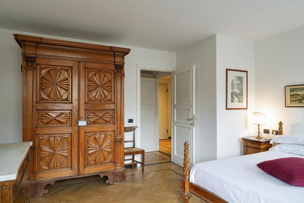 A bed or beds in a room at Casa Giustiniani by Wonderful Italy