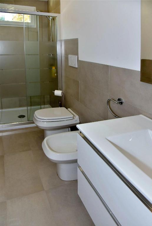 Kúpeľňa v ubytovaní Garda Bloom Holiday Apartments