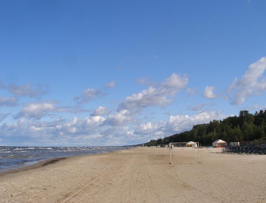 a sandy beach with a soccer goal on it at Holiday Apartment in Liepāja