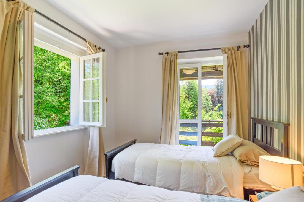 A bed or beds in a room at Lovely Villa with huge Garden surrounded by Nature