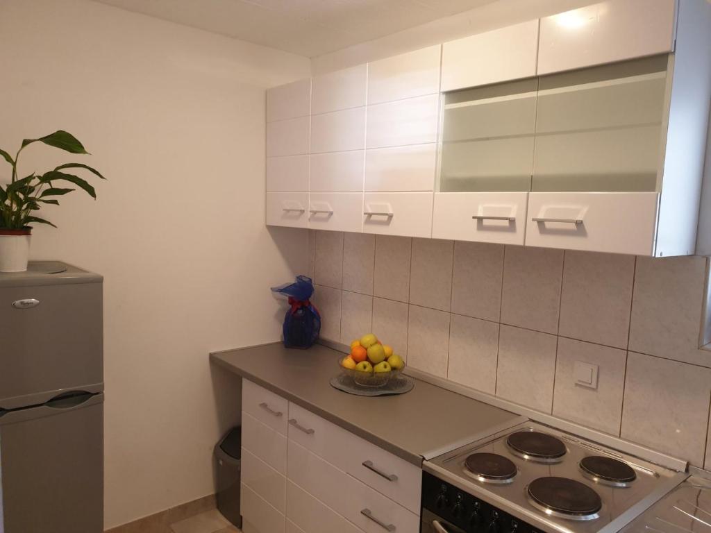 Kuchyňa alebo kuchynka v ubytovaní Apartments Kuzman