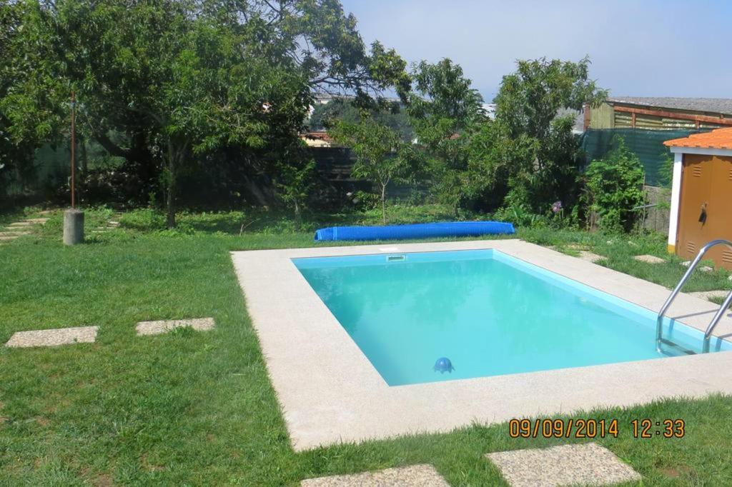 a small swimming pool in a yard with grass at Charming Villa near Anta with Private Pool in Anta