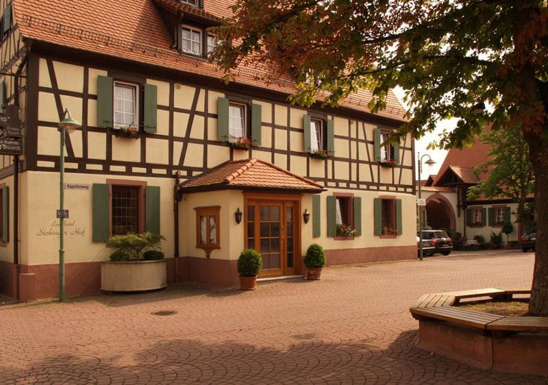 a building on a street in front of a building at Landhotel Sickinger Hof in Walldorf