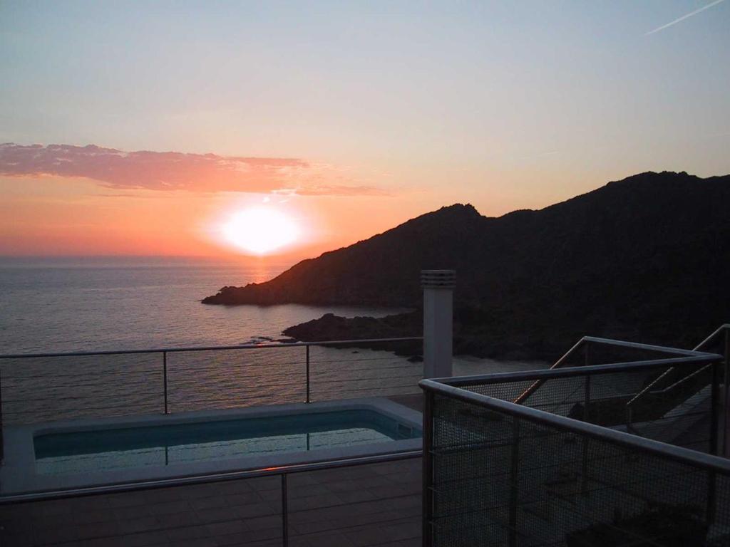 a view of the sunset from a cruise ship at Barca Serena in Port de la Selva