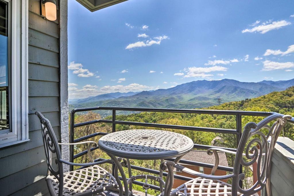 a table and chairs on a balcony with a view of mountains at Studio about 3 Mi to Great Smoky Mountain Natl Park! in Gatlinburg