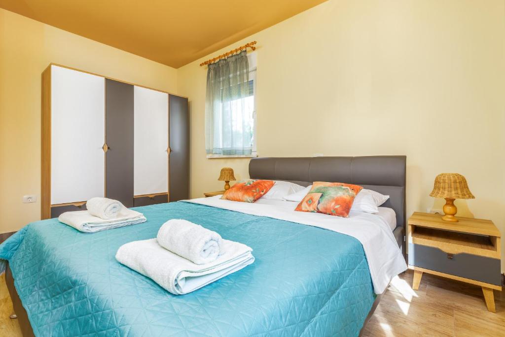 Postel nebo postele na pokoji v ubytování Apartmani Monte