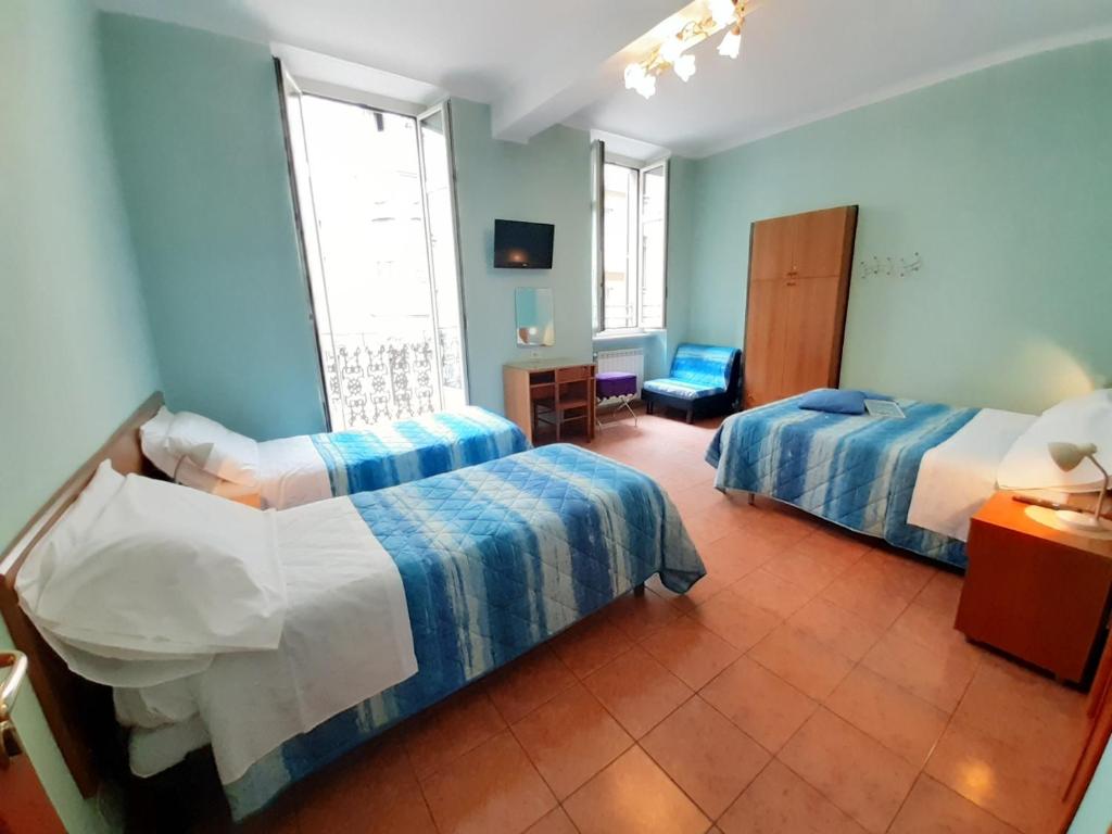 Postel nebo postele na pokoji v ubytování Hotel Alba Torino centro