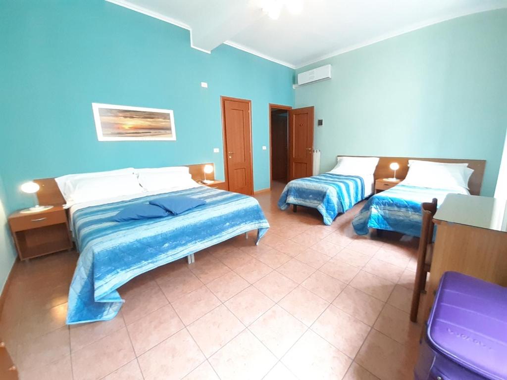 Postel nebo postele na pokoji v ubytování Hotel Alba Torino centro