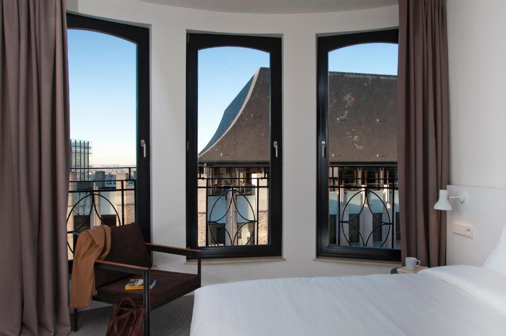 Postel nebo postele na pokoji v ubytování 9Hotel Central