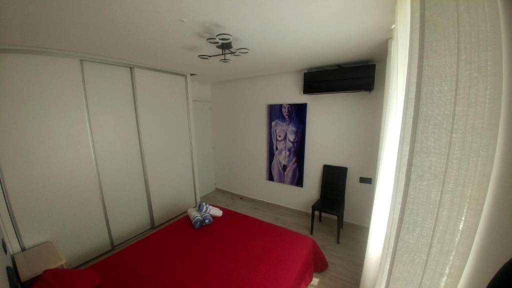 A bed or beds in a room at Aster Apartamento