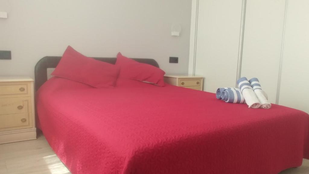 A bed or beds in a room at Aster Apartamento