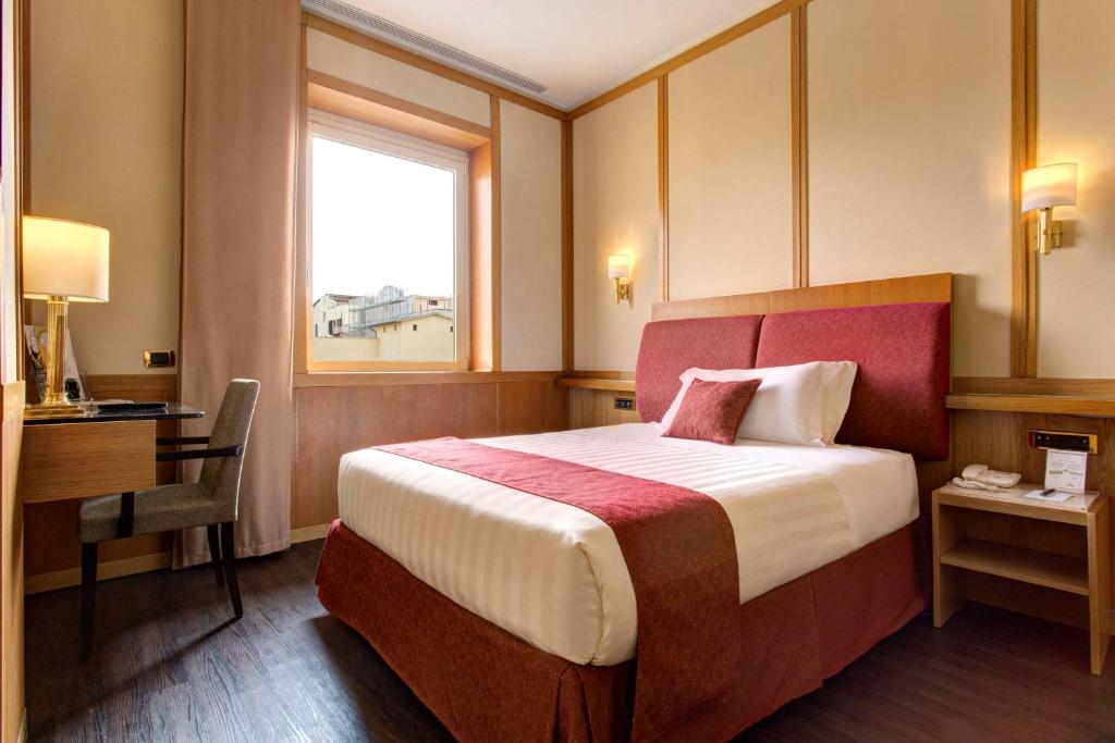Łóżko lub łóżka w pokoju w obiekcie Best Western Hotel President - Colosseo