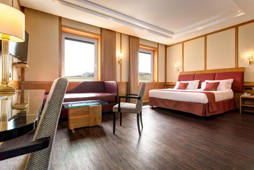 Łóżko lub łóżka w pokoju w obiekcie Best Western Hotel President - Colosseo
