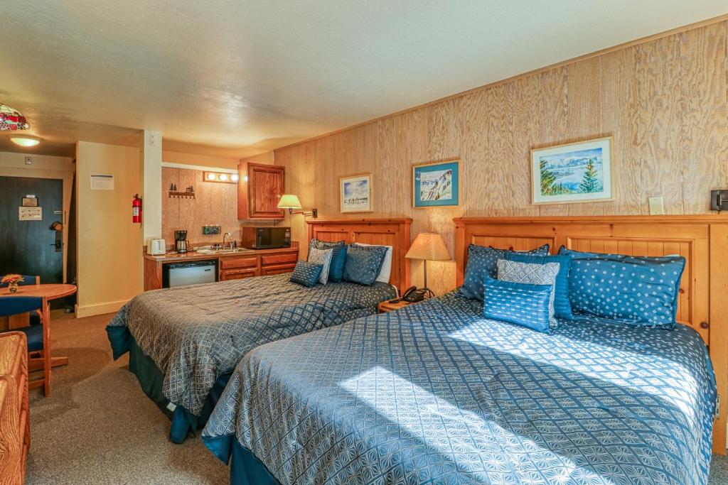 a hotel room with two beds and a kitchen at Northstar Original Village Studio One in Truckee