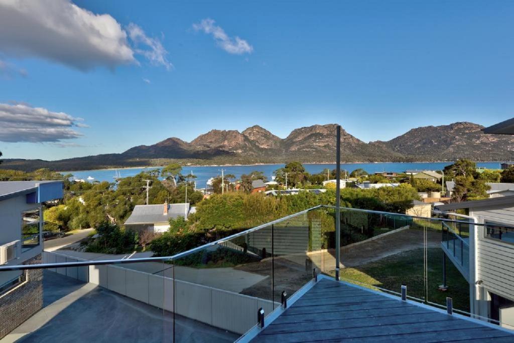 a view of the water from the balcony of a house at Deja Blu 2 in Coles Bay