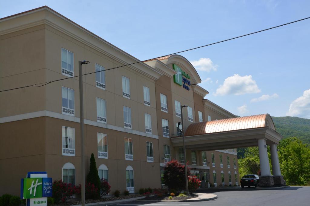 a large building with a street sign on top of it at Holiday Inn Express & Suites Caryville, an IHG Hotel in Caryville