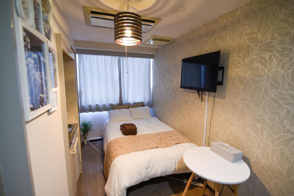TV a/nebo společenská místnost v ubytování Vail sta Takenotsuka