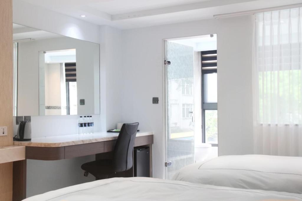 Postel nebo postele na pokoji v ubytování Gamalan Spring Hotel