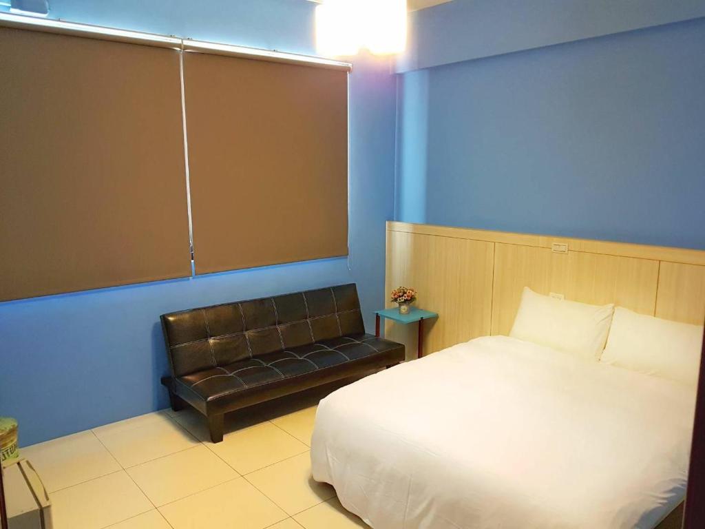 Postel nebo postele na pokoji v ubytování Cen zhi bao minsu homestay