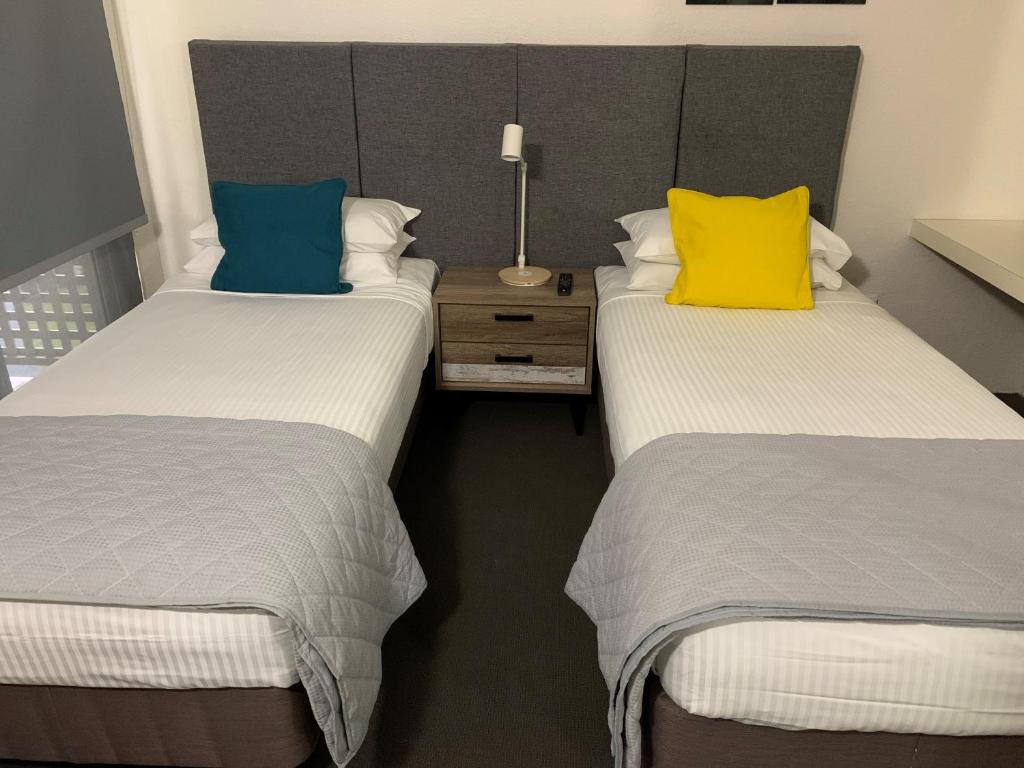 Postel nebo postele na pokoji v ubytování Reef Resort Villas Port Douglas