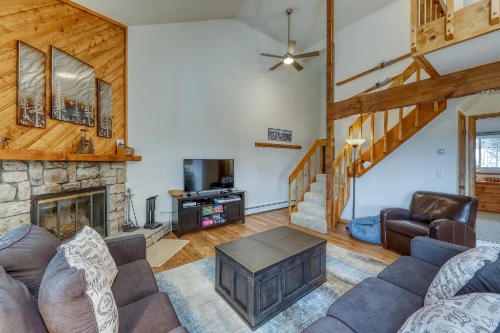 a living room with a couch and a fireplace at Buffalo Ridge Condos in Silverthorne