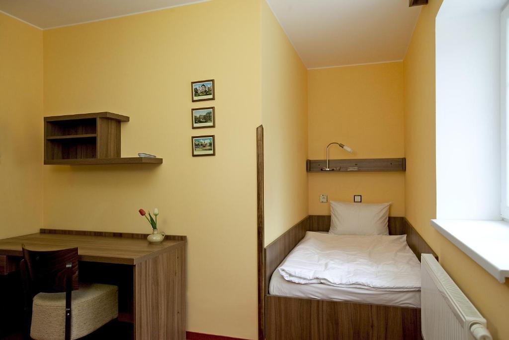 Postel nebo postele na pokoji v ubytování Penzion Na Hvězdě