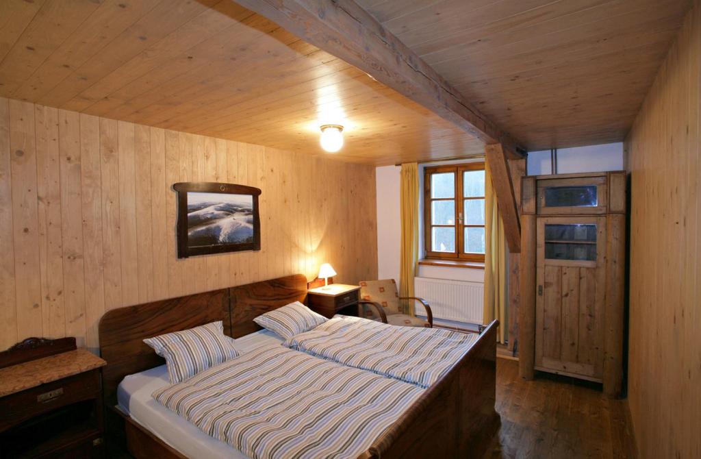 Postel nebo postele na pokoji v ubytování Apartmány Chalupa u Floriánka