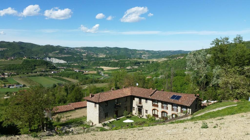 an old house on a hill in a valley at La Luna Buona in Vesime