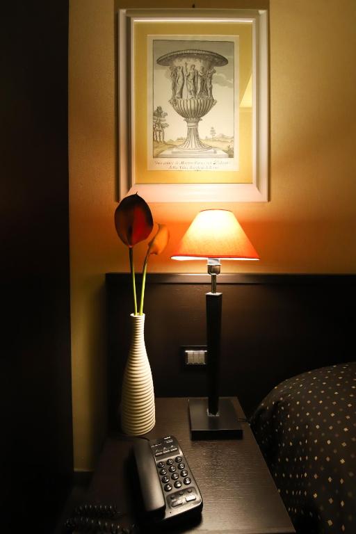 Łóżko lub łóżka w pokoju w obiekcie Hotel Latinum
