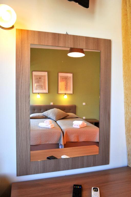 Postel nebo postele na pokoji v ubytování Ilios Hotel