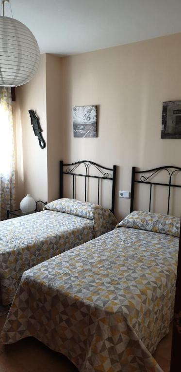 Posteľ alebo postele v izbe v ubytovaní Encartador Apartamento para Descanso Vacacional
