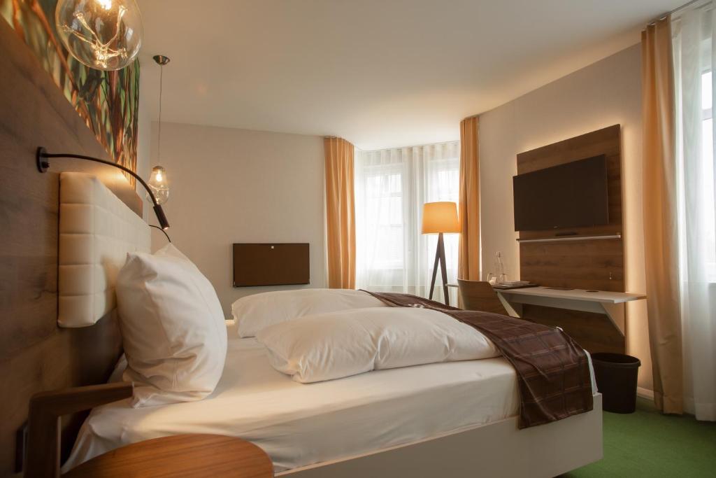 Postel nebo postele na pokoji v ubytování Das Schokoladenhotel